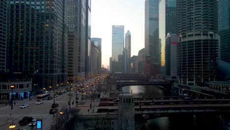 aerial-drone-footage-of-Chicago-downtown-near-lake-Michigan-bridge-during-overcast-sunset