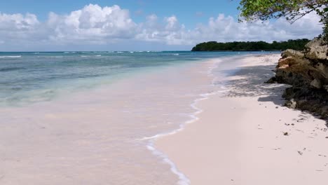 Waves-of-Caribbean-Sea-reaching-sandy-beach-of-Playita-Beach
