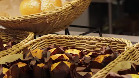 Basket-display-of-bite-sized-sweet-cakes-in-Italian-delicatessen-shop-window-Naples