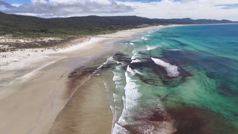 Mason-Bay,-Stewart-Island-aerial-birds-eye-view,-coastal-scenery