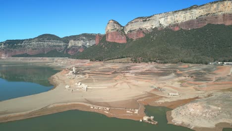 Sau-swamp-dike-in-Catalonia,-Spain,-intense-drought-in-2024-Drone-flight-in-a-beautiful-natural-park-in-Spain,-Europe