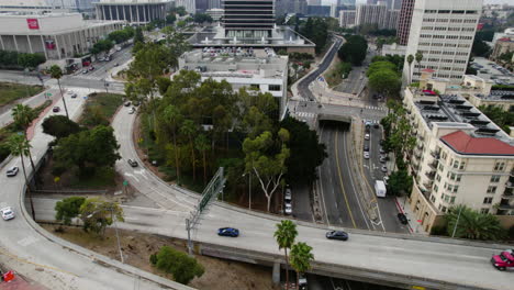 Los-Angeles-CA-USA,-Aerial-View-of-Hollywood-Freeway-Traffic,-Figueroa-and-Hope-Street,-Central-Buildings,-Drone-Shot