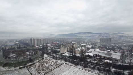 Aerial-view,-industrial-east-european-town-on-a-cloudy-day-during-winter-season