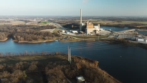 Wide-aerial-drone-shot-of-Lake-Swepco-with-power-plant,-tilting-down,-day