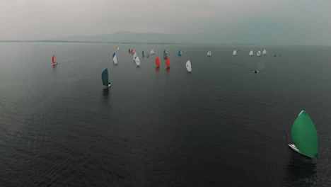 A-dozen-colorful-sailboats-head-to-port-on-Lake-Constance