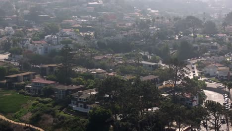 La-Jolla,-California's-seaside-neighborhood-of-oceanfront-mansions---ascending-tilt-down-aerial