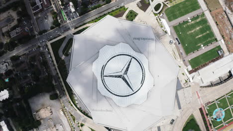 Top-down-footage-of-Mercedes-Benz-Stadium-with-huge-company-logo-on-retractable-roof