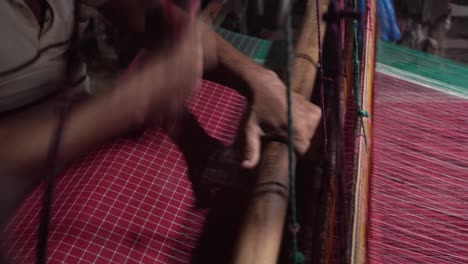 A-weaver-weaves-cloth-in-an-ancient-way