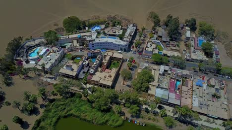 Huacachina-Oasis-in-Peru's-Atacama-Desert,-Aerial-Drone-Shot-Overhead,-South-America