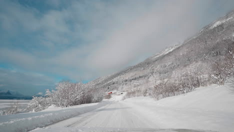 POV-video-of-driving-through-Norway's-Western-Fjords-in-winter,-showcasing-a-journey-along-snowy-roads