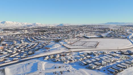 Icelandic-City-Surrounded-By-Snowy-Mountains