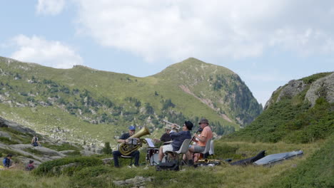 Jazz-musicians-playing-in-mountain-of-Dolomites,-Italy,-static-view