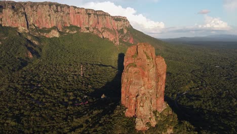 Rock-spire-and-rugged-escarpment-cliffs-in-golden-light-in-Bolivia