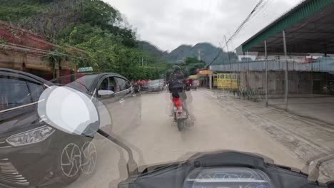 POV-riding-scooter-in-Vietnam-narrow-countryside-streets