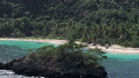 Telephoto-aerial-establisher-beach-Ermitano-in-Samana,-holiday-paradise