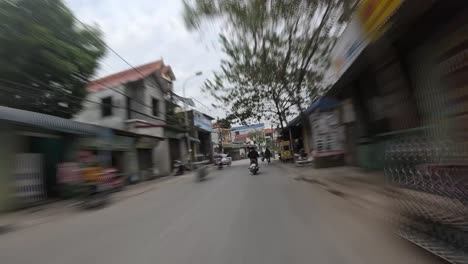 Riding-motorbike-in-Vietnam-urban-area,-POV-time-lapse