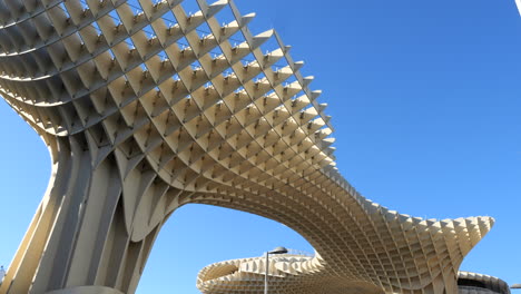 Pedestrians-Walking-On-The-Street-At-The-Metropol-Parasol-In-Seville,-Spain