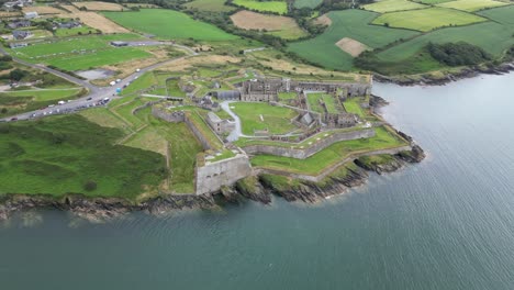 Charles-fort-near-kinsale,-ireland,-with-ocean-and-green-landscape,-aerial-view