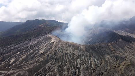 The-awe-of-Mount-Bromo's-volcanic-activity-–-a-natural-spectacle-of-billowing-smoke-and-fiery-eruptions-in-East-Java,-Indonesia