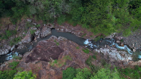 The-winding-cajones-de-chame-river-in-panama,-surrounded-by-lush-greenery,-aerial-view