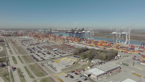 An-aerial-establishing-shot-captures-the-Port-of-Houston's-Barbours-Cut-Container-Terminal-under-clear,-sunny-skies-in-Houston,-Texas