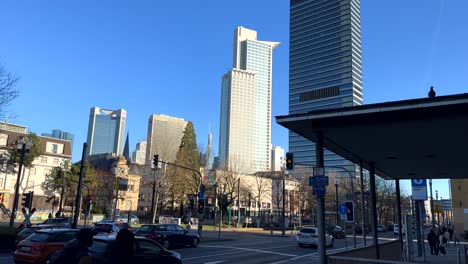 Traffic-on-main-road-in-downtown-of-Frankfurt-City-with-skyscraper-in-background