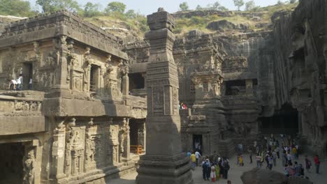 View-of-Kailasha-temple-identical-illustration-on-the-new-currency-note-of-twenty-Indian-rupees-at-the-Ellora-Caves-near-Aurangabad,-Stone-Pillar-at-the-Kailasha-Temple