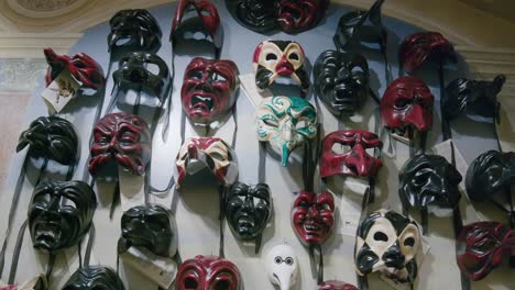 Red-and-Black-Diabolical-Masks-at-Ca'-Macana,-Venice-Italy