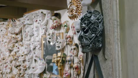 Unique-mechanical-mask-on-display-at-Ca'-Macana-amidst-others,-Venice