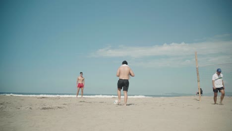 Beach-Soccer-Played-by-Two-Men-at-La-Union,-Philippines