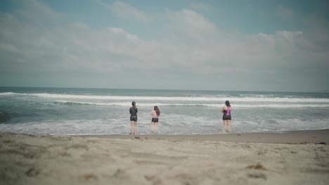 Group-of-Ladies-Taking-Photos-of-Ocean-Waves-at-La-Union-Beach-in-the-Philippines