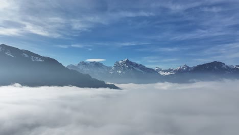 Alpine-Majesty:-Snow-Capped-Peaks-Overlook-Misty-Valleys-in-Swiss-Alps