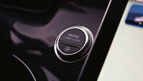 Static-close-up-shot-of-person-push-round-knob-button-to-start-car-engine