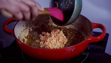 Adding-a-bowl-of-lentils-to-a-curry-dish-to-make-green-papaya-curry