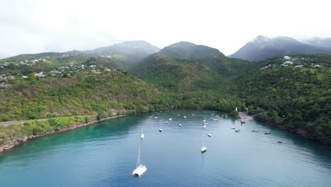Scenic-Landscape-Of-Anse-A-La-Barque-Bay-With-Boats-In-Vieux-Habitants,-Guadeloupe---Aerial-Drone-Shot