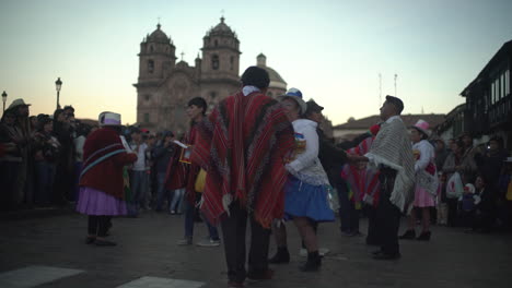 In-Cusco,-Peru,-a-vibrant-religious-celebration-unfolds-for-Nuestra-Señora-de-Fátima,-where-joyfully-adorned-women-and-men,-dressed-in-their-polleras-and-jobona,-parade-and-dance-through-the-streets