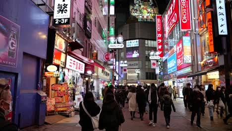 POV-walking-through-Center-Gai-in-Tokyo,-Shibuya-at-night