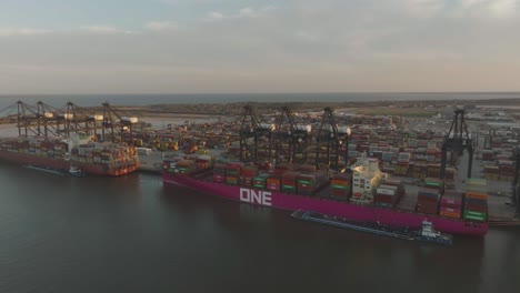 An-aerial-establishing-shot-captures-container-ships-being-loaded-at-the-Port-of-Houston's-Bayport-Container-Terminal-in-Houston,-Texas