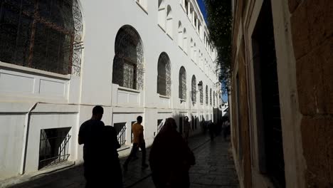 Silhouettes-of-people-in-shadows-of-Muslim-mosque-make-way-to-prayer-worship