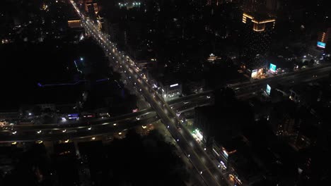 Rajkot-aerial-drone-view-Lots-of-vehicles-coming-from-four-wheels-and-bikes-and-lots-of-vehicles-going-under-the-bridge