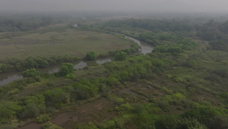 Aerial-shot-over-Indian-farm-land-covered-in-smoke-from-crop-burning