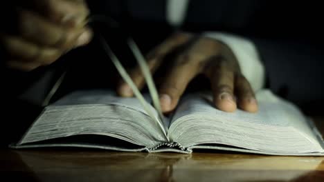 praying-to-god-with-bible-on-table-with-people-stock-video-stock-footage