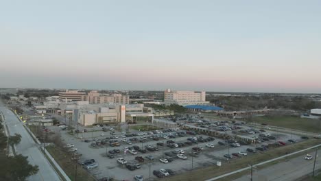 An-aerial-view-of-HCA-Houston-Healthcare-Hospital-Clear-Lake-and-HCA-Houston-Healthcare-Heart-Hospital,-at-twilight-in-Webster,-Texas
