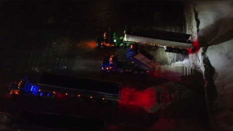 Truck-Unloading-Snow-From-Streets-of-Montreal,-Canada-on-Cold-Winter-Night