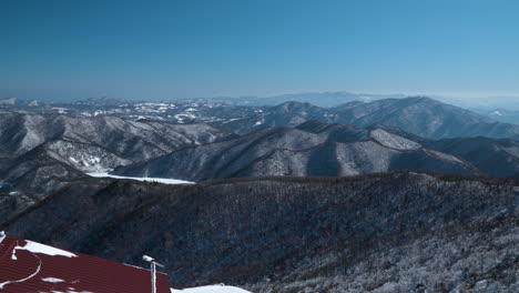 Amazing-Winter-Mountains-Range-Terrain-Skyline-Panorama-viewed-from-Balwangsan-Mountain-Top-Skywalk,-Pyeongchang,-Gangwon-do,-South-Korea