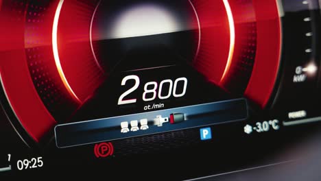 Close-up-of-car-digital-tachometer-dashboard-with-red-animation-expand