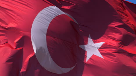 Macro-close-up-of-Turkish-flag-fluttering-on-sunny-day