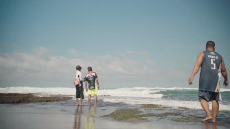 People-Fishing-and-Passing-By-Along-a-Beach-at-La-Union,-Philippines