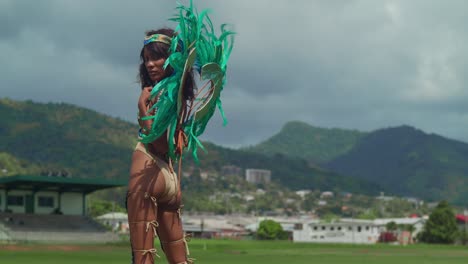 Amidst-the-tropical-splendor-of-Trinidad's-Caribbean-landscape,-a-young-girl-in-carnival-attire-adds-vibrant-color-to-the-scene