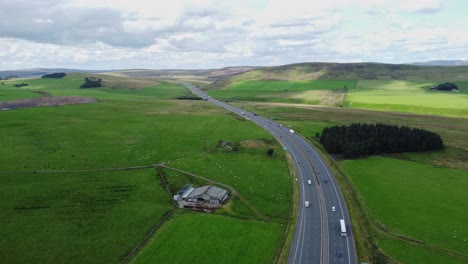 Motorway-Running-Through-Countryside-in-Cumbria,-Hills-in-Distance